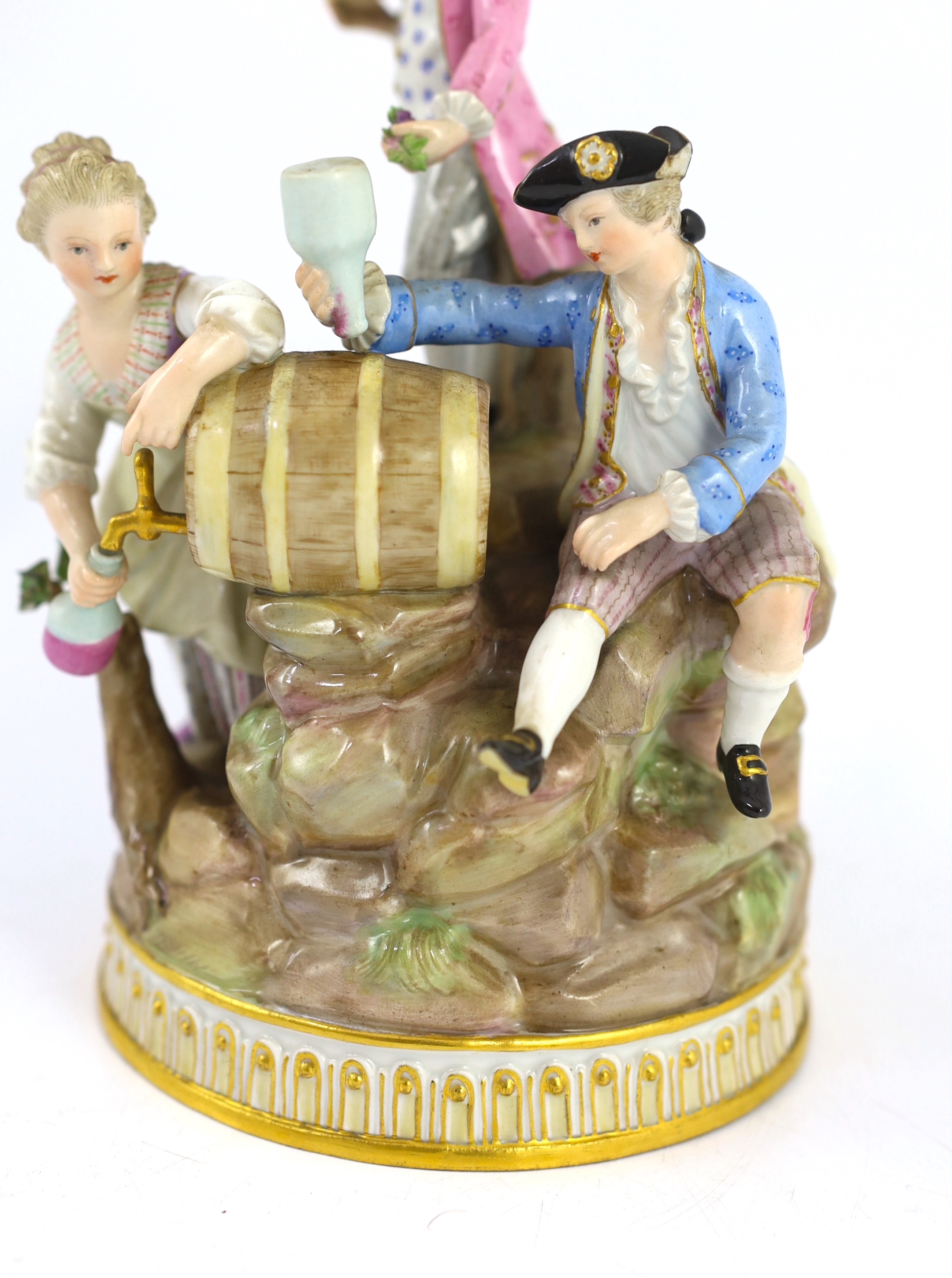 A Meissen group of grape pickers with barrels of wine, 19th century, chips to hats